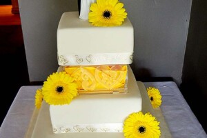 Cake wedding flowers - yellow gerberas